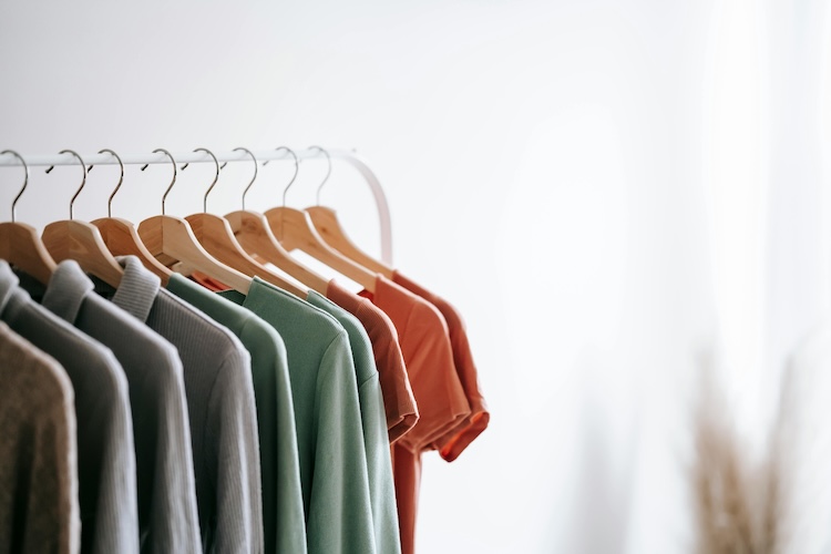 shirts hanging on wire rack